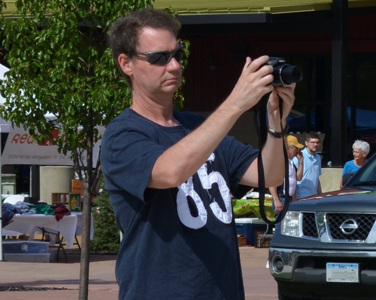 Bill Grady with camera at outdoor event